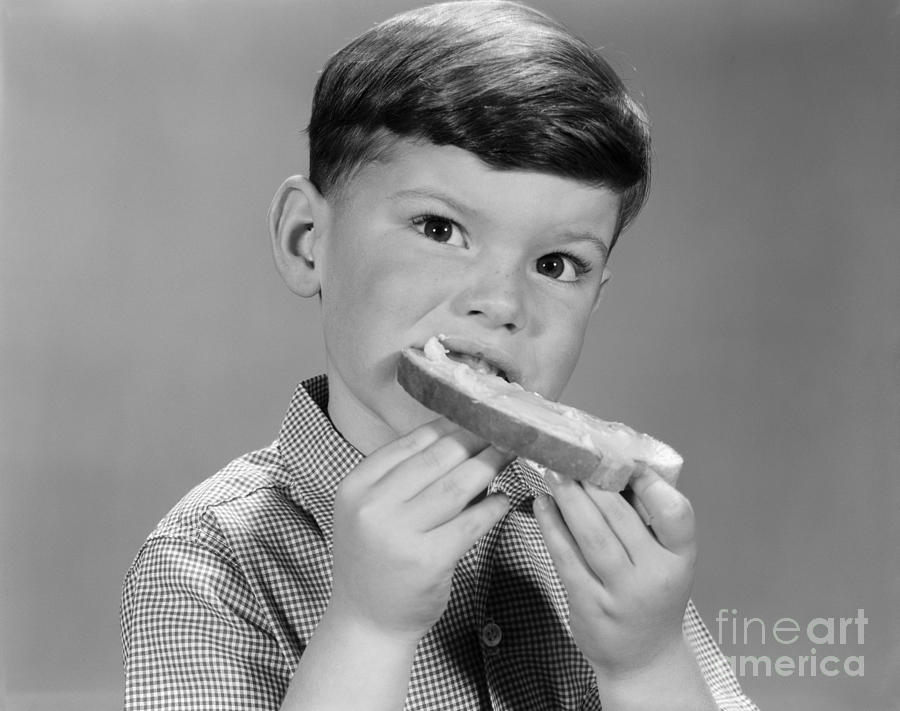 Boy Eating Buttered Bread, C.1960s Photograph by H. Armstrong Roberts/ClassicStock