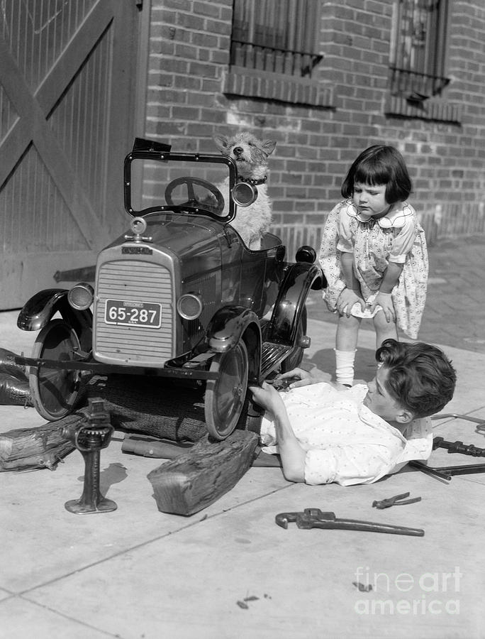 Boy Fixing Girls Toy Car, C.1920s Photograph by H. Armstrong Roberts/ClassicStock