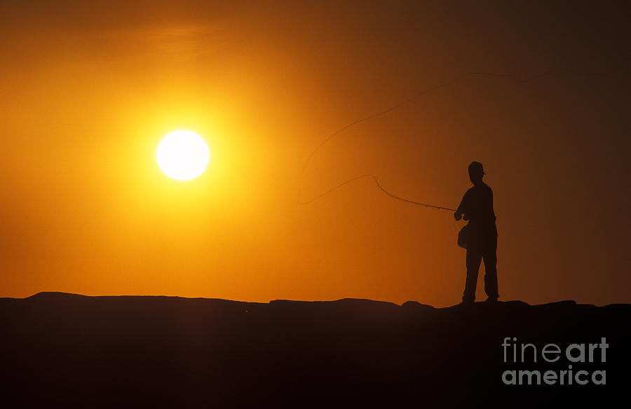 Sunset Photograph - Boy Flyfishing by John Greim