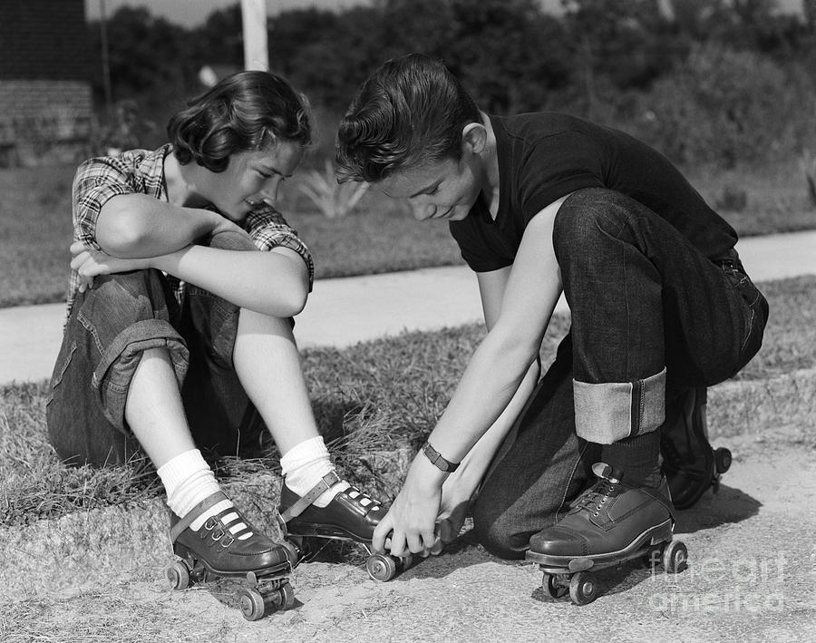 Vintage Photograph - Boy Helping Girl With Roller Skates by H. Armstrong Roberts/ClassicStock
