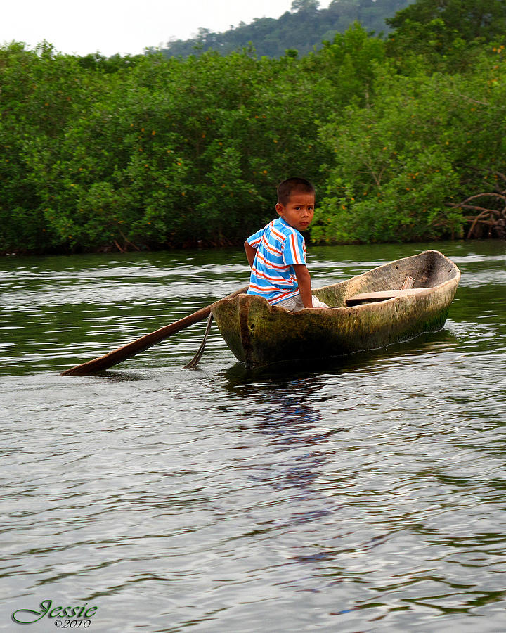 Boy In Dugout Canoe Panama Photograph by Jessica Westermeyer