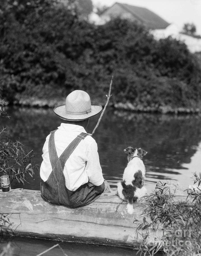 Boy In Straw Hat Fishing Photograph by H Armstrong Roberts ClassicStock