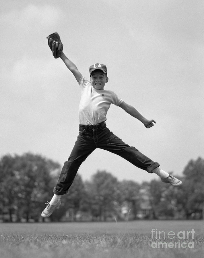 Boy Jumping To Catch Baseball, C.1960s Photograph by H. Armstrong Roberts/ClassicStock