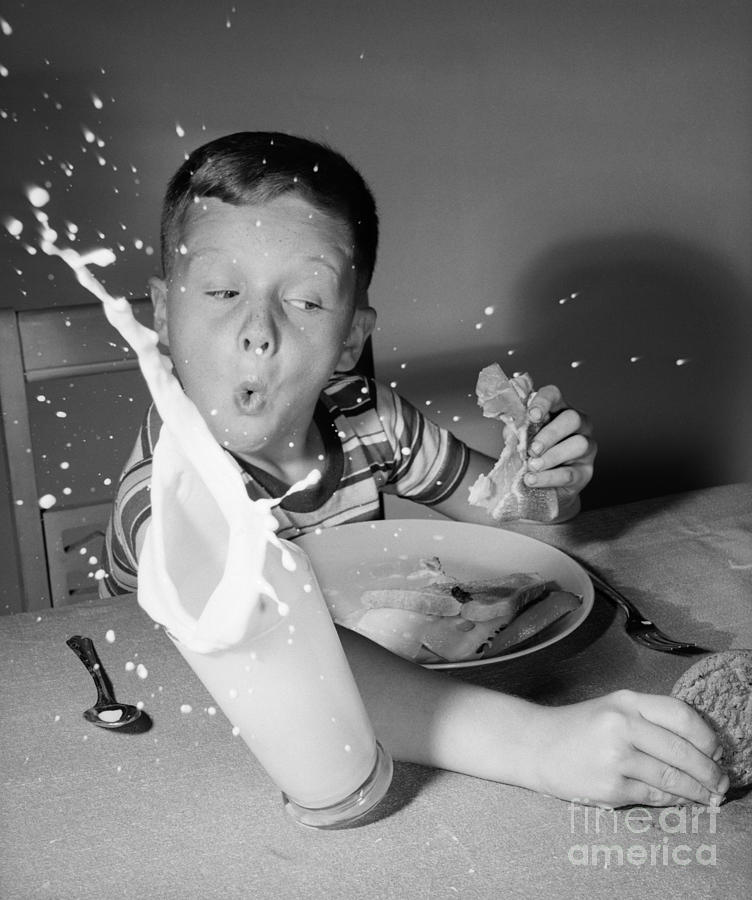 Boy Knocking Over Milk, C.1960s Photograph by Debrocke/ClassicStock