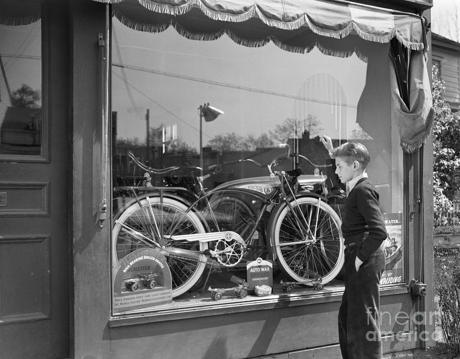 Boy Looking At Bike In Store Window Photograph by H. Armstrong Roberts/ClassicStock