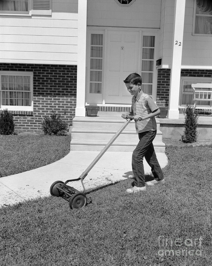 Boy Mowing The Lawn, C.1960s Photograph by H. Armstrong Roberts/ClassicStock