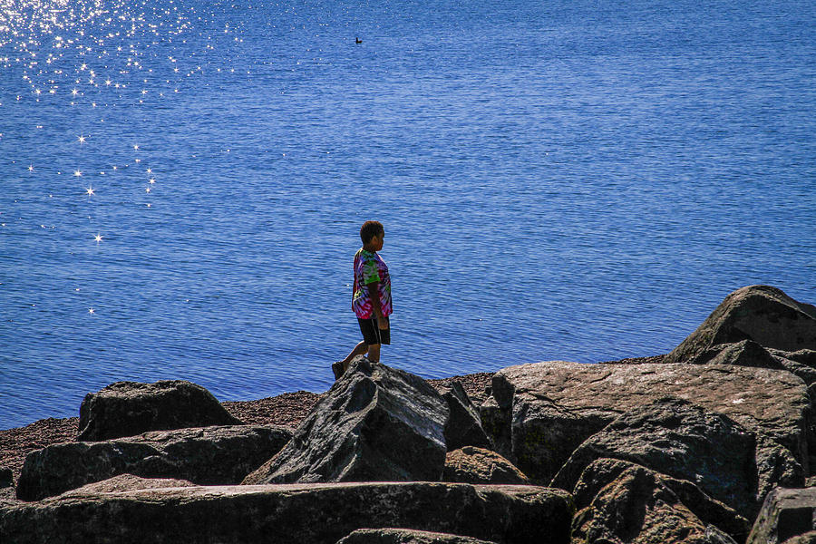 Boy on shore walk Photograph by Bonnie Follett