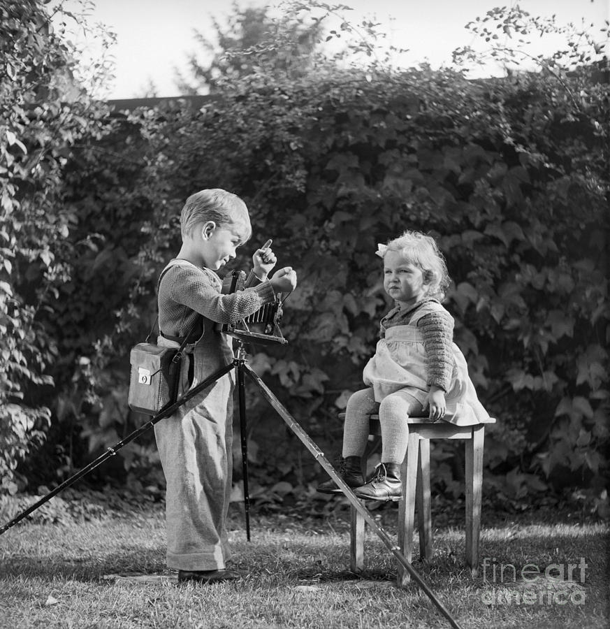 Boy Photographing Little Girl, C.1930s Photograph by Luthy/ClassicStock