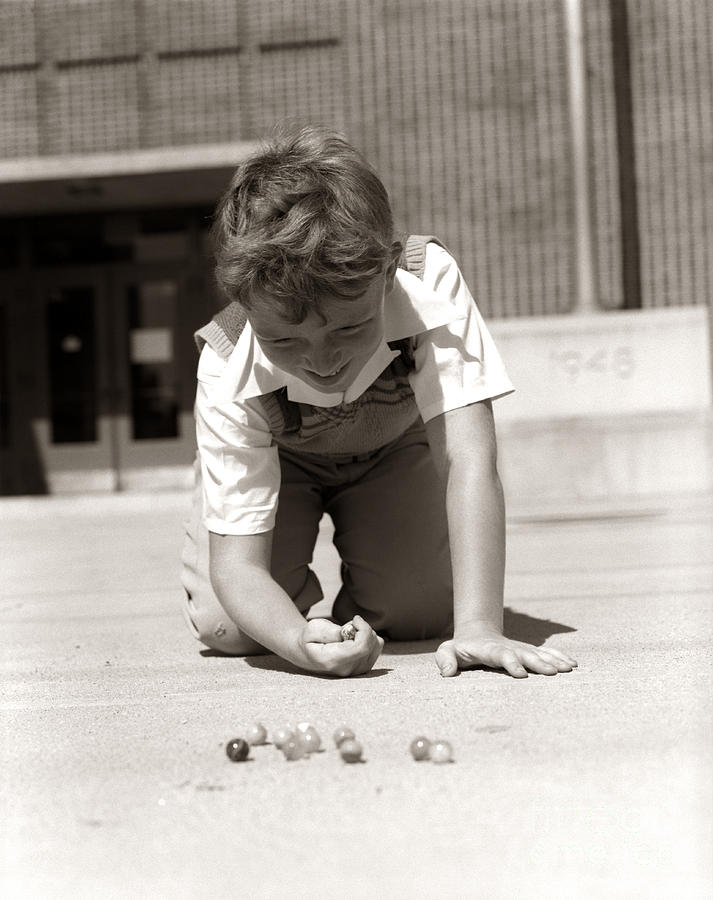 Boy Playing Marbles, C.1950s Photograph by H. Armstrong Roberts/ClassicStock