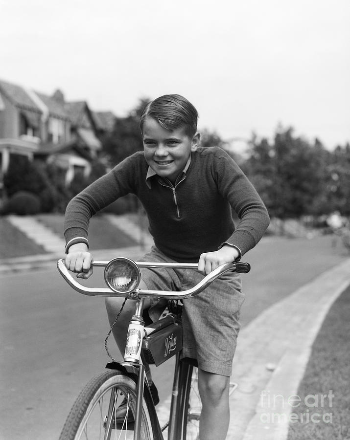 Boy Riding Bicycle, C.1930s Photograph by H. Armstrong Roberts/ClassicStock