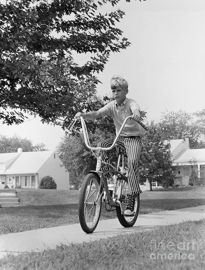 Boy Riding Bike On Suburban Sidewalk Photograph by H. Armstrong Roberts/ClassicStock