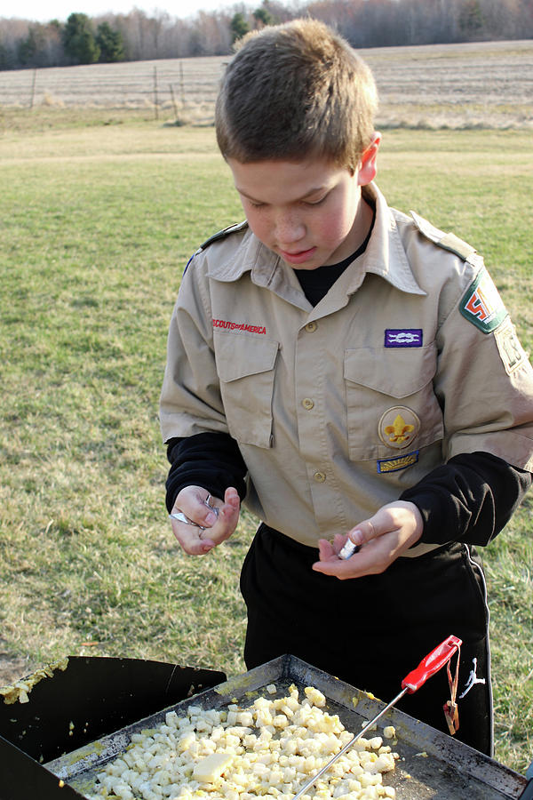Boy Scout Making Breakfast Photograph by Brook Burling