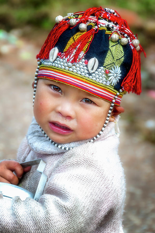 Boy with a red cap. Photograph by Usha Peddamatham