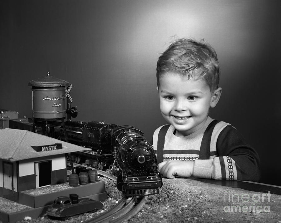 Boy With Model Train, C.1950s Photograph by H. Armstrong Roberts/ClassicStock