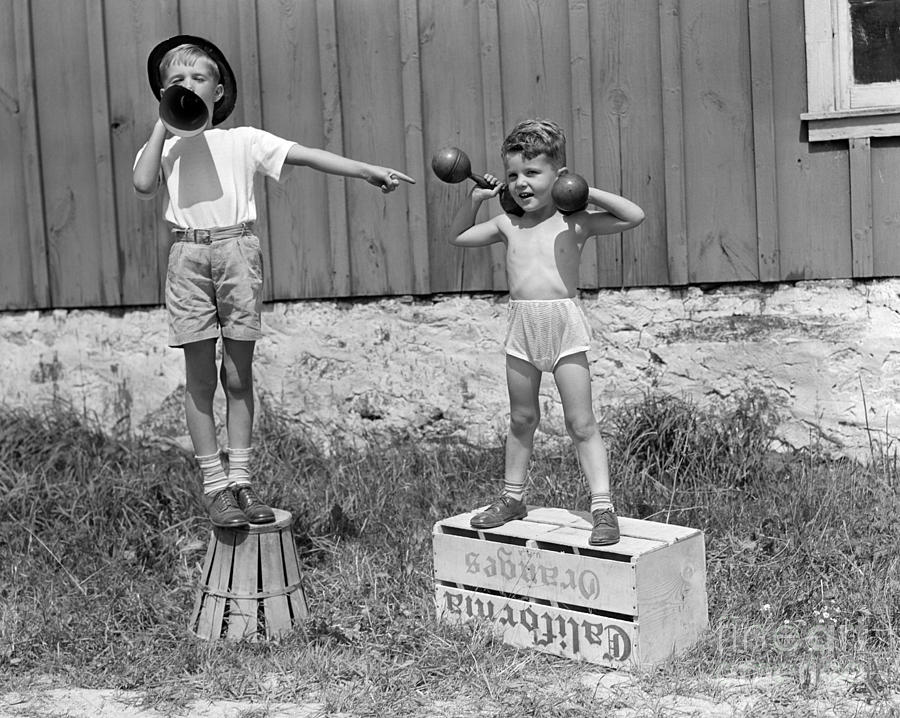 Boys Playing Carnival Strongman Photograph by H. Armstrong Roberts/ClassicStock