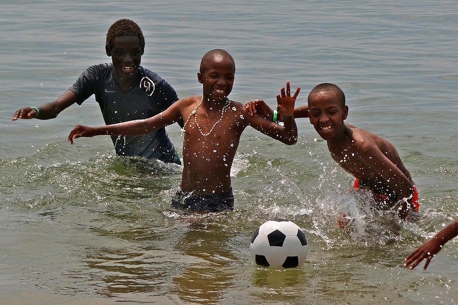 Boys Playing On Beach Outing Photograph by Emeybee