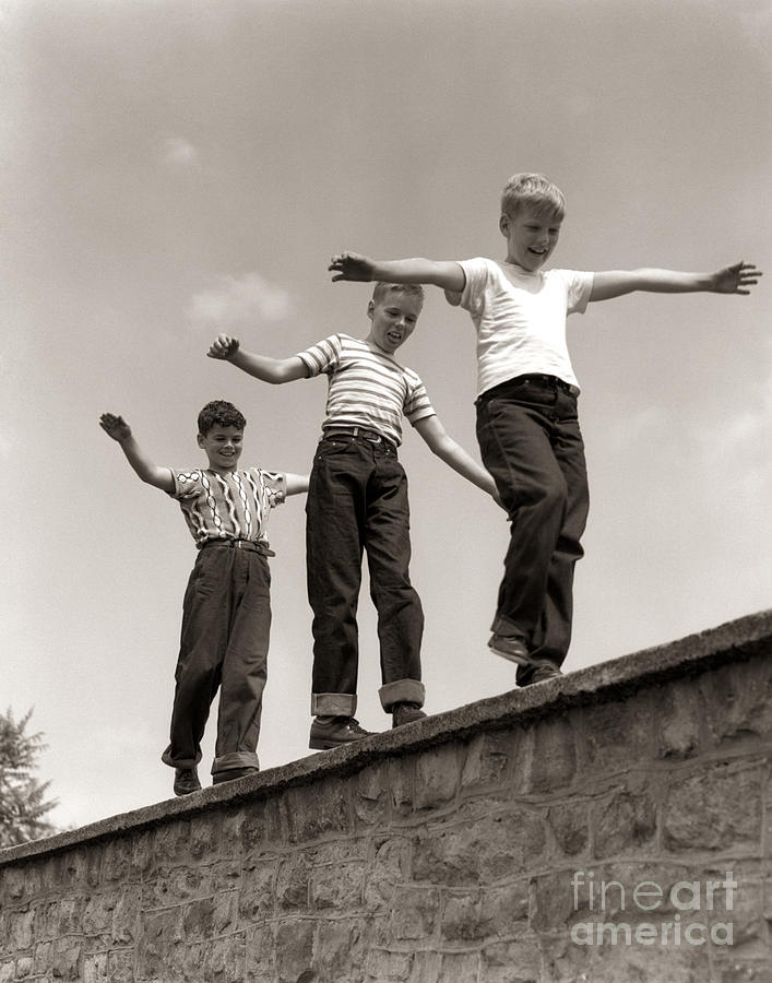 Boys Walking On Wall, C.1950s Photograph by H. Armstrong Roberts/ClassicStock