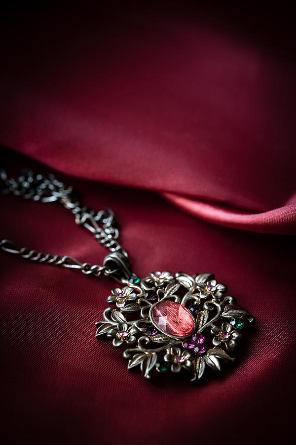 Brass pendant with red gem Photograph by Jaroslaw Blaminsky