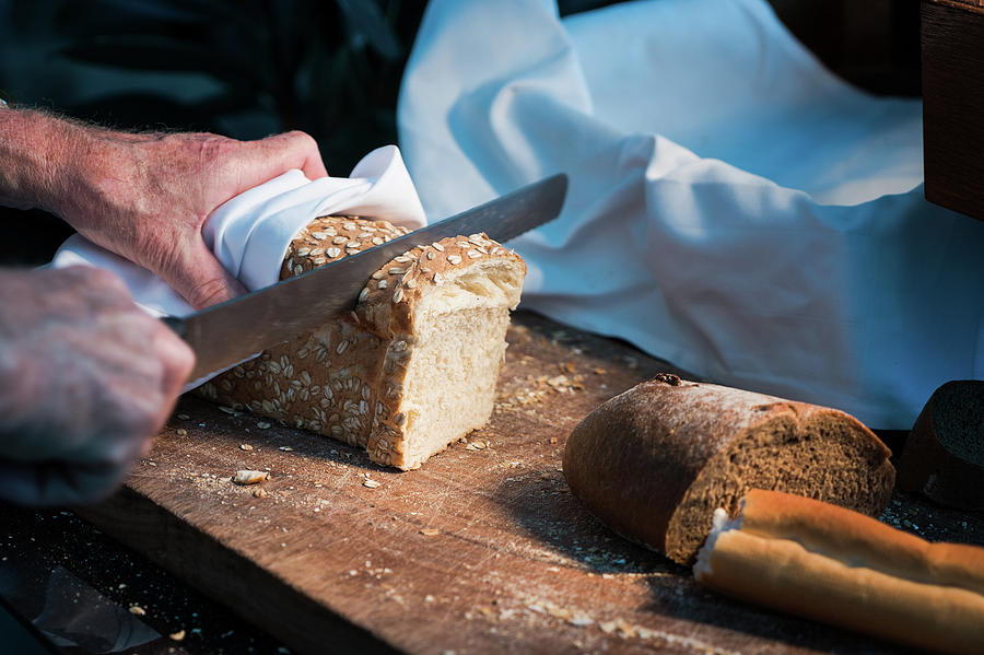 Bread Separate By Knife And Hand Photograph by Anek Suwannaphoom