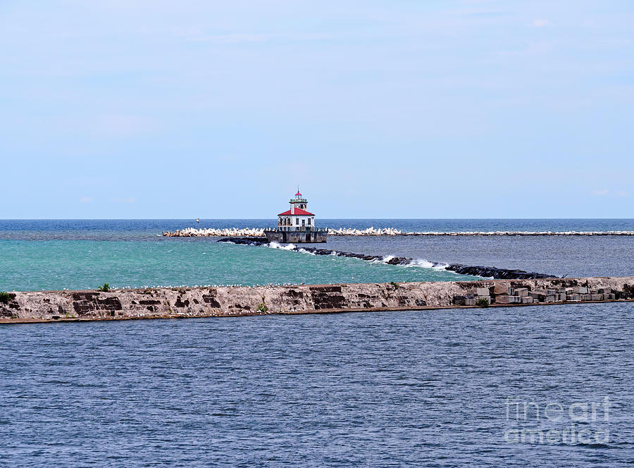 Breakwater and lighthouse in Oswego New York Photograph by Louise Heusinkveld