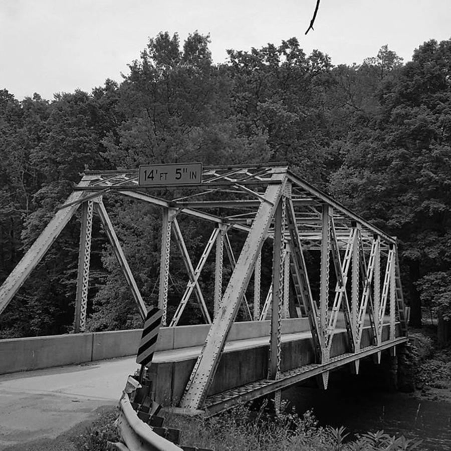 Black And White Photograph - Old metal bridge by Kimberly  W