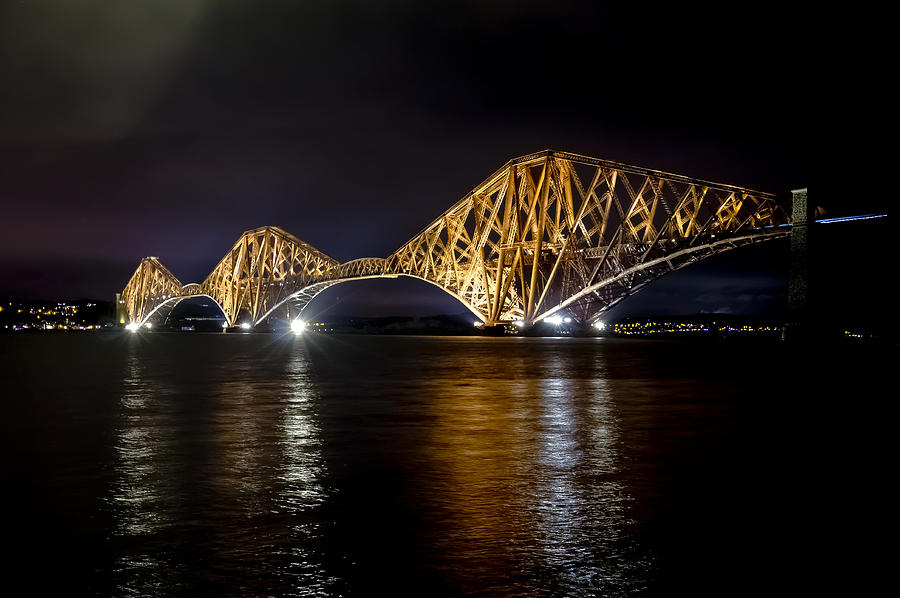 Bridge over water lights. Photograph by Elena Perelman