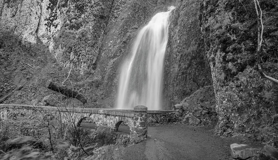 Bridge to waterfall Black and White  Photograph by John McGraw