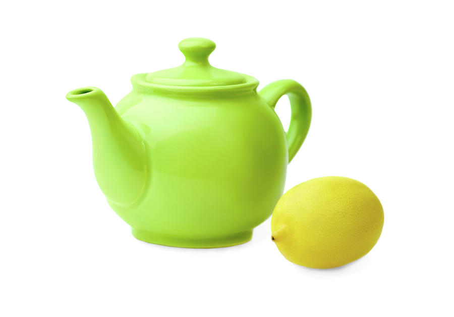 Lemon Photograph - Bright green  teapot and lemon on  white background. by Yurii Agibalov