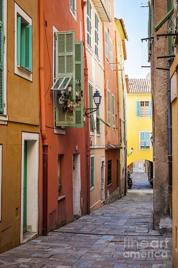 Bright houses on old street in Villefranche-sur-Mer Photograph by Elena Elisseeva