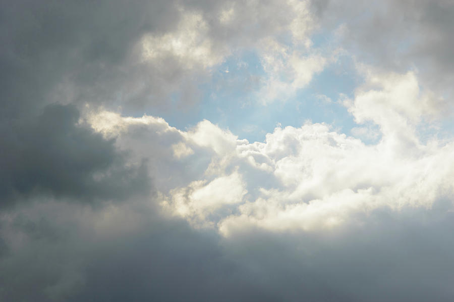 Bright sun reflected on clouds in sky Photograph by Johan Ferret - Fine ...