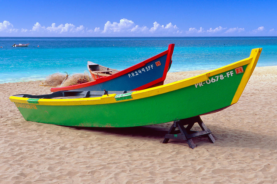 Transportation Photograph - Brightly Painted Fishing Boats on a Caribbean Beach by George Oze