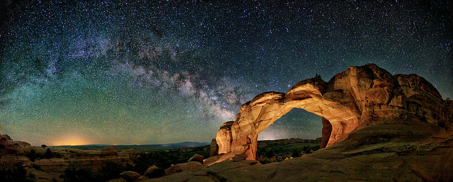 The Milky Way is visible on the horizon in this panorama of Turret Arch, Arches National Park, Utah  Photograph by Lena Owens - OLena Art Vibrant Palette Knife and Graphic Design