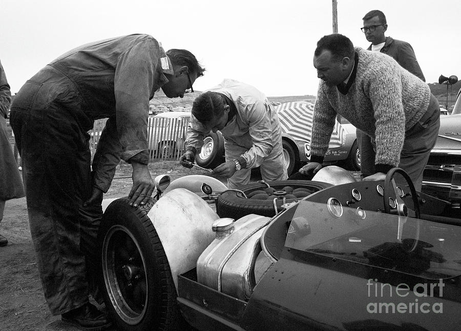 Bruce Mclaren working with Crew in pit at Laguna Seca Photograph by Robert K Blaisdell