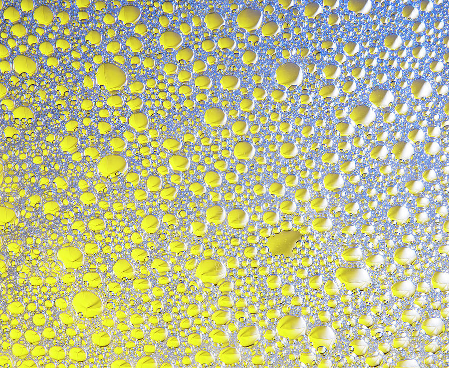 Bubbles In Blue And Yellow As Background Or Texture Photograph