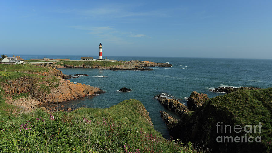 Buchan Ness Lighthouse and the North Sea Photograph by Maria Gaellman