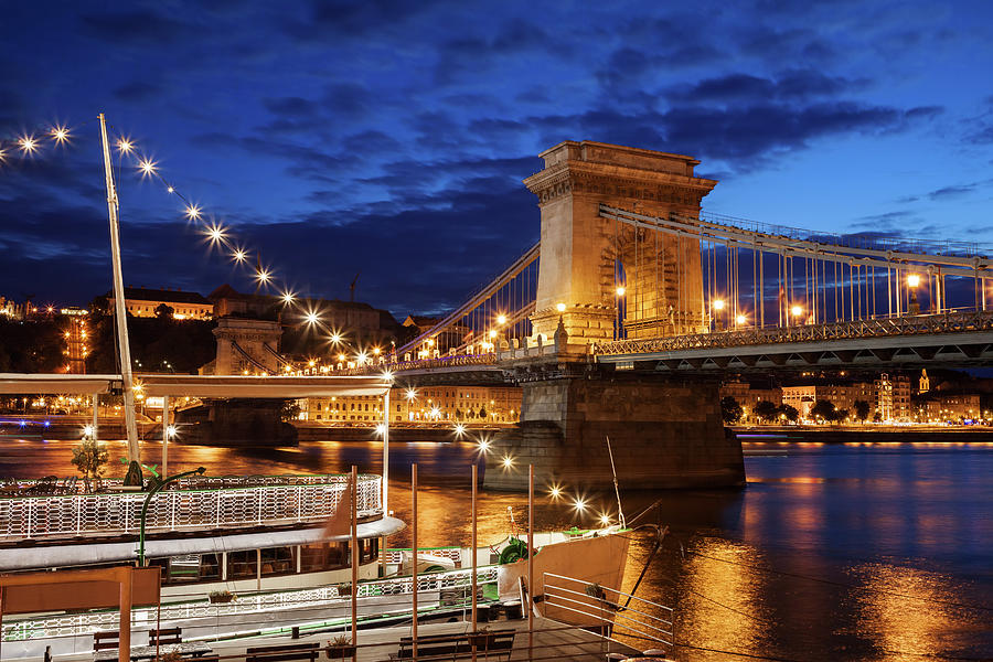 Architecture Photograph - Budapest By Night With Chain Bridge On Danube River by Artur Bogacki