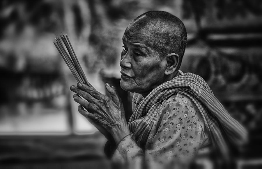 Buddhist nun prays Photograph by David Longstreath