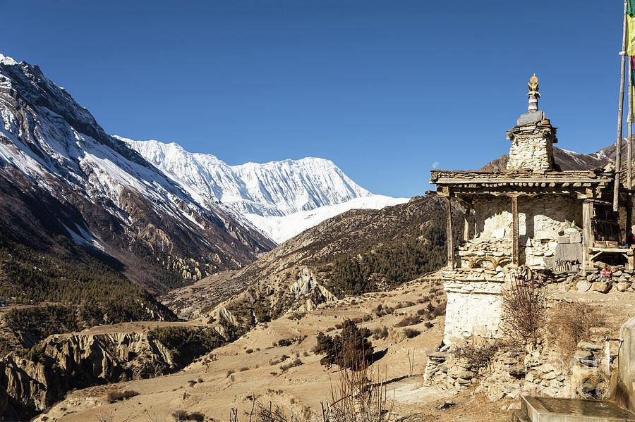 Buddhist stupa on the Annapurna circuit trek in the Himalayas in Photograph by Didier Marti