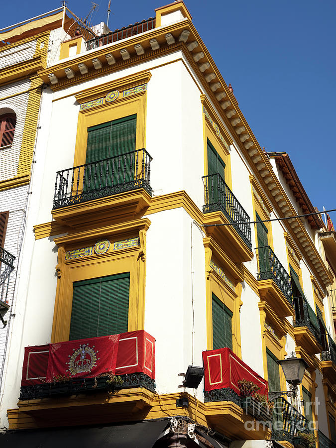 Building Colors in Seville Photograph by John Rizzuto