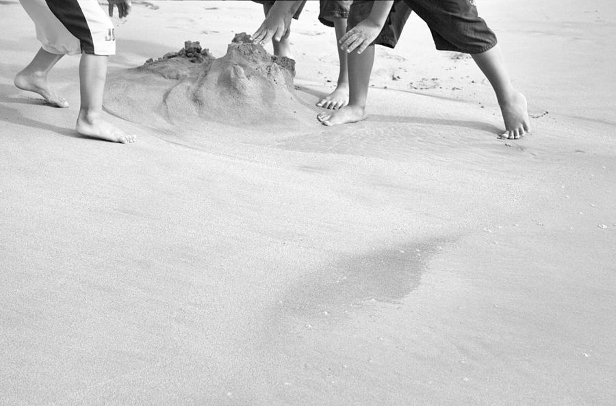 Black And White Photograph - Building Sandcastles by Theresa Tahara