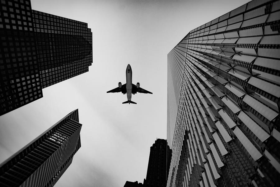Buildings and Jet Photograph by Greg Waters