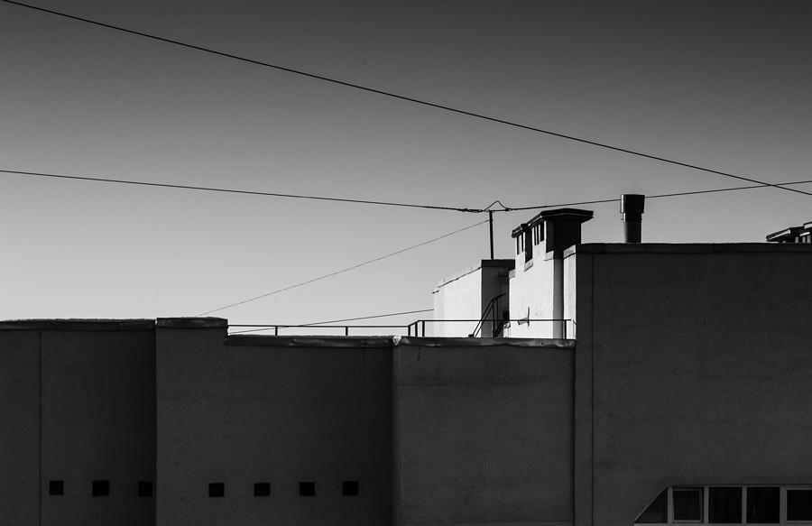 Buildings at Dusk in Monochrome Photograph by John Williams