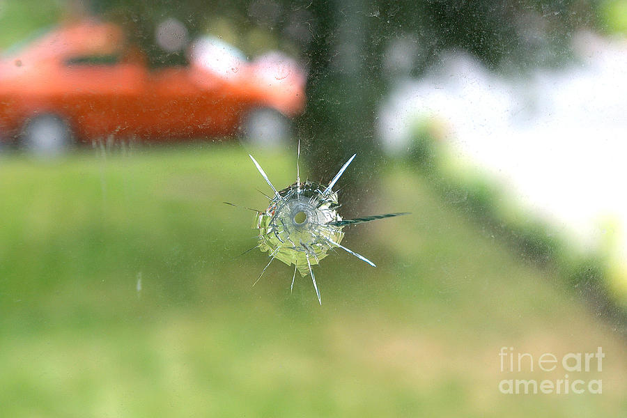 Bullet Hole In Residential Windowpane Photograph by Scimat