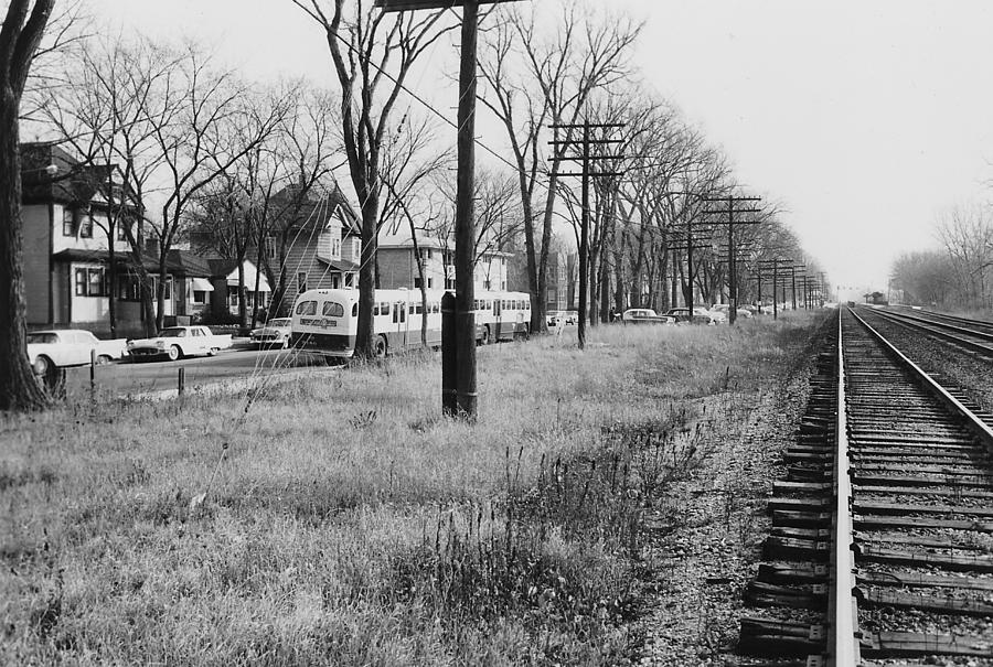 Bus Passes Tracks in Chicago Photograph by Chicago and North Western Historical Society