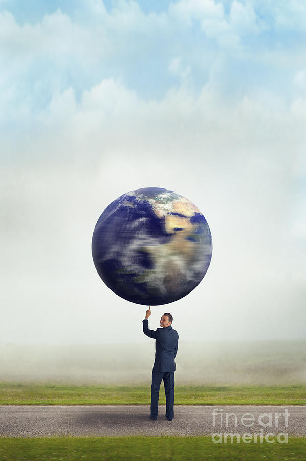Businessman Holding Planet Earth With One Finger  Photograph by Lee Avison