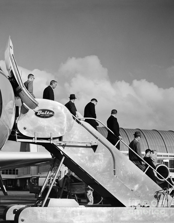 Businessmen Exiting A Plane Photograph by H. Armstrong Roberts/ClassicStock