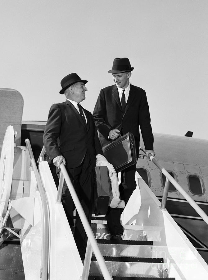 Businessmen Exiting Airplane Photograph by H. Armstrong Roberts/ClassicStock