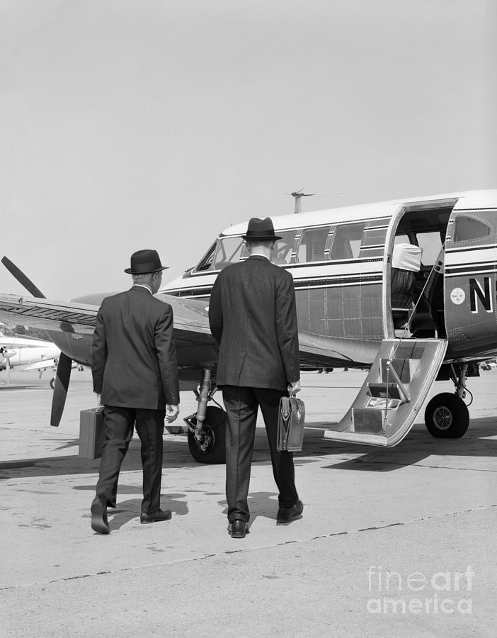 Businessmen Walking To Plane Photograph by H. Armstrong Roberts/ClassicStock