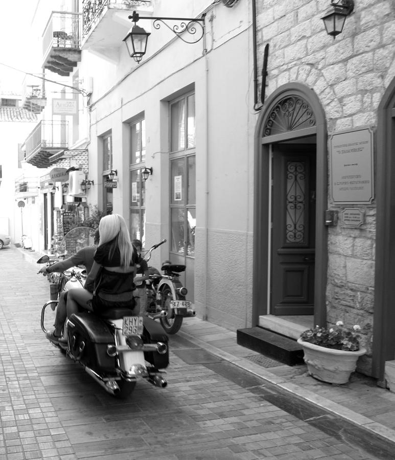 BW Girl Riding on Motorcycle with Handsome Bike Rider Speed Stone Paved Street Nafplion Greece Photograph by John Shiron