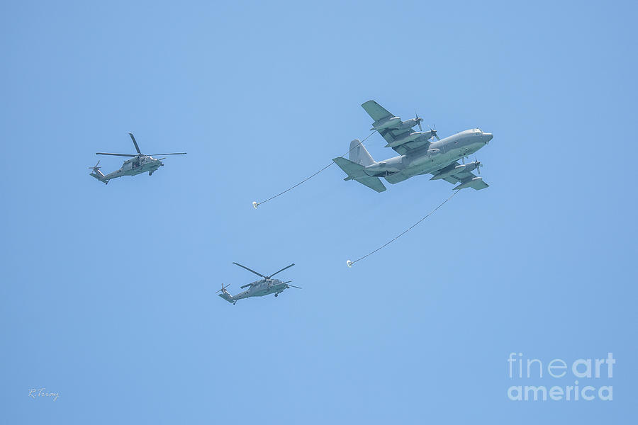 A couple Sikorsky Helicopters about to Join up on a C-130 Hercules Aircraft Photograph by Rene Triay FineArt Photos